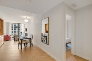 A modern apartment with a dining area, a kitchen, a living room, and a bedroom. - Luxury Miami 1BR Apt with Pool  (Miami)