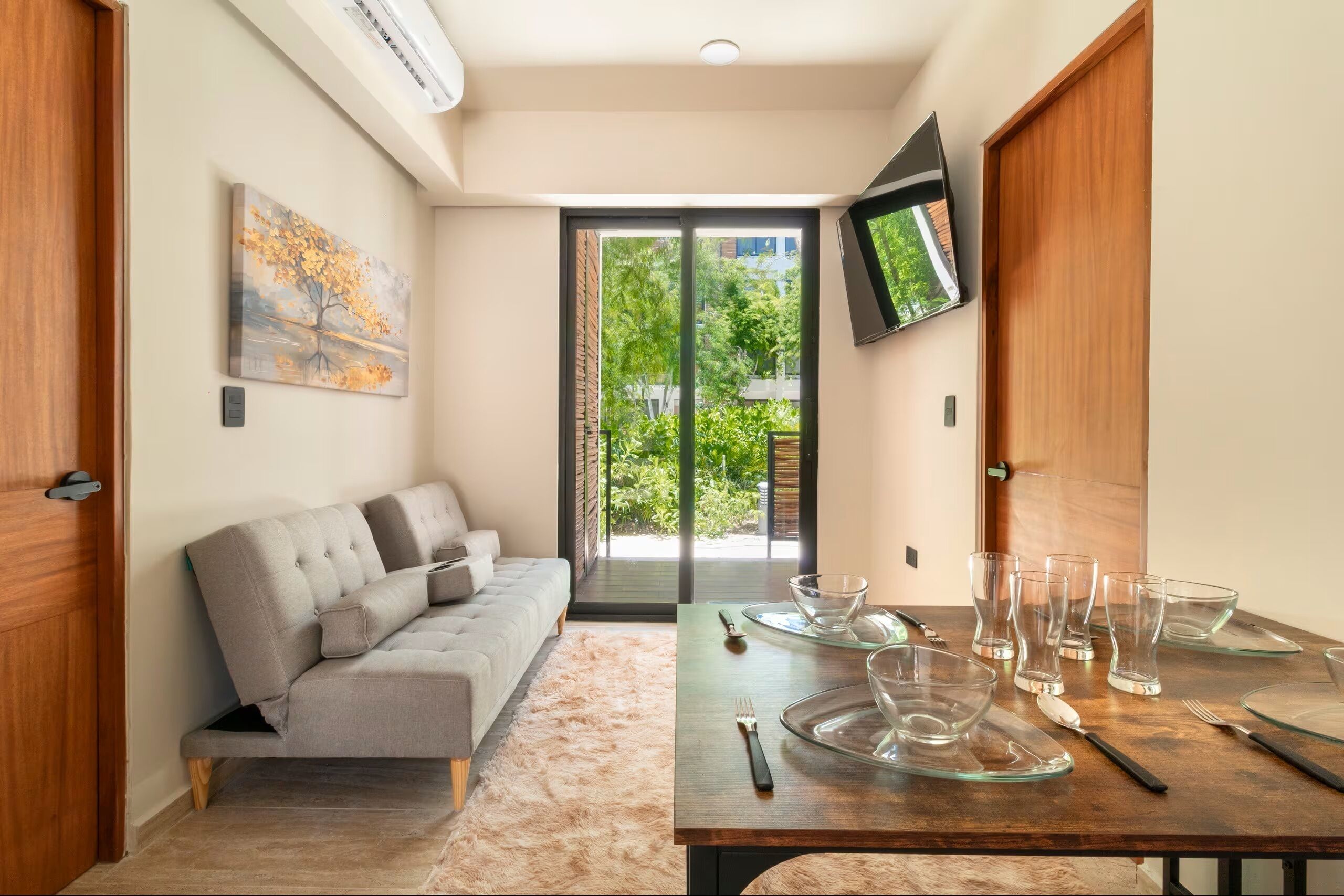 Deluxe Apartment, Patio | Living area | 32-inch flat-screen TV with digital channels