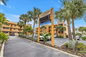 A sign for West Windsor Waterfront Resort with a clear view of the parking area and resort buildings. - NEW! Flamingo Breeze Waterfront • Walk to Beach and Restaurants (Treasure Island)