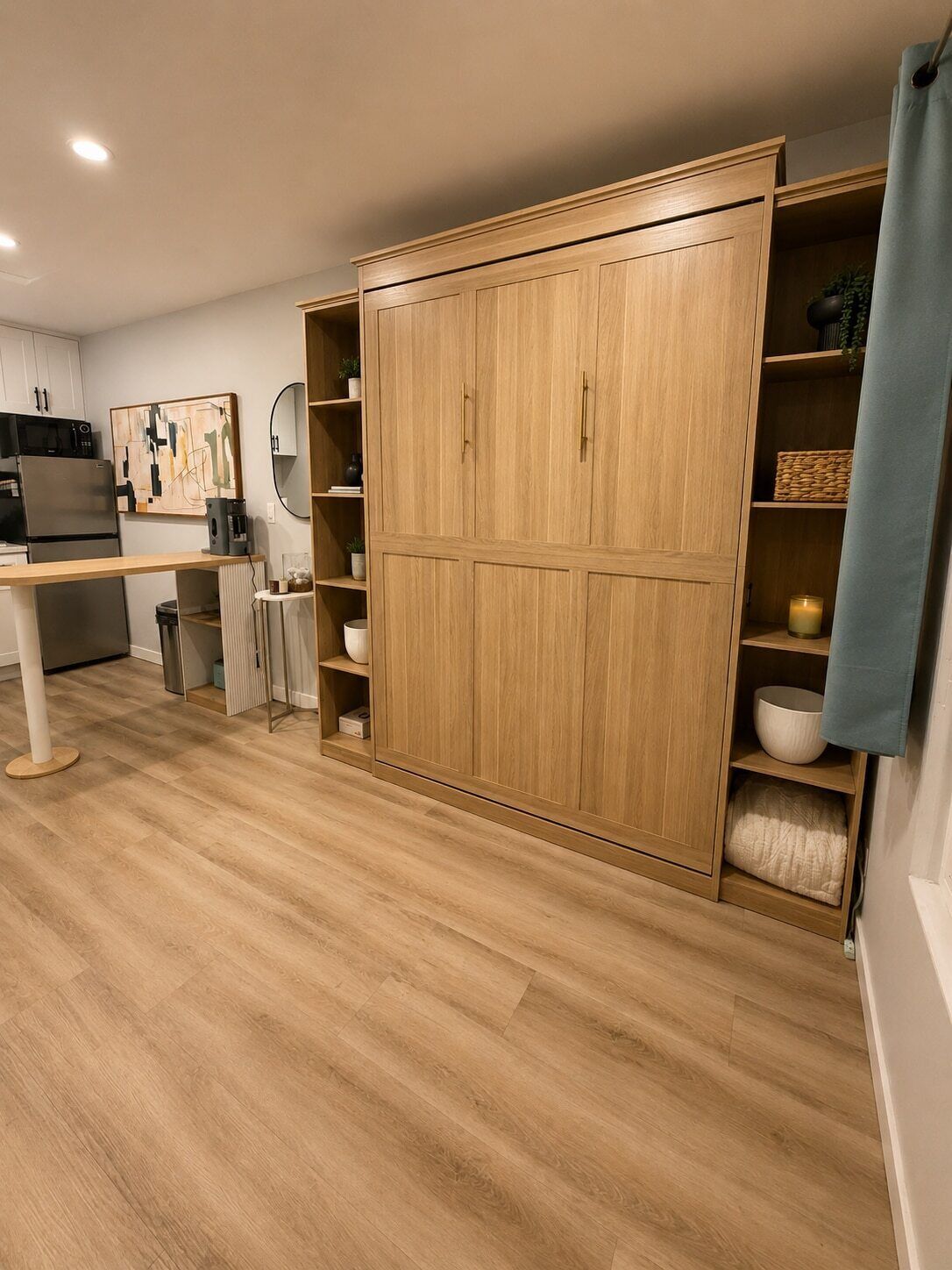A modern kitchen with wooden cabinets, a dining table, and a microwave.