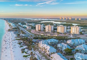 A coastal residential area with beachfront properties, a road, and a marina. - Bright renovated studio steps from Bonita Beach & balcony gulf breezes all day (Bonita Springs)