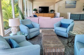 A living room with a sofa set, armchairs, a coffee table, and a TV. - The Dream House / Gulf Front Luxury Retreat (Marathon)