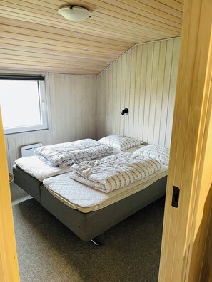 A compact room with a single bed, a window, and a ceiling light. - Spacious holiday home in West Jutland (Nørre Nebel)