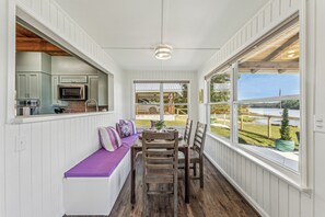 A kitchen with white cabinets and a built-in microwave. - All about that Bass lake house on beautiful lay lake (Shelby)
