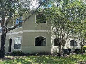 A two-story building with a symmetrical facade, arched windows, and a central entrance. - Cozy Avalon 1-bedroom in beautiful Clearwater-newly remodeled (Clearwater)