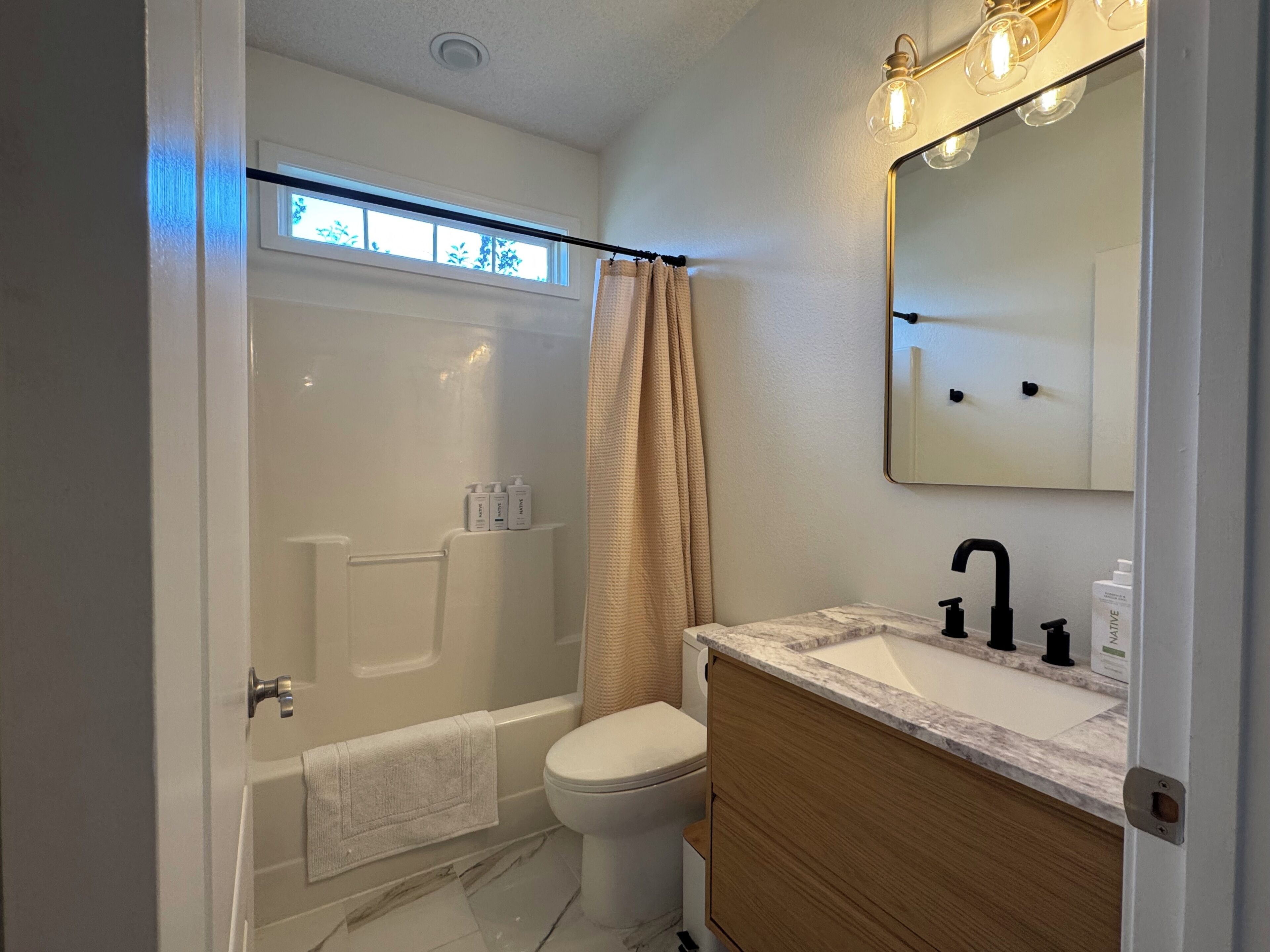Jetted bath, hair dryer, towels, soap