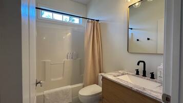 Jetted bath, hair dryer, towels, soap
