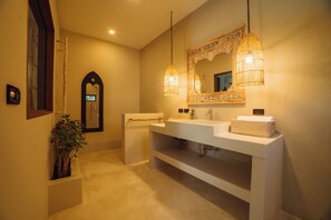 A modern bathroom with a large mirror, two sinks, and a hanging light fixture. - Stylish 3-bedroom villa with king suites near Lamai Beach (Chang Wat Surat Thani)