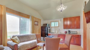 A compact living space with a kitchenette, a dining area with a glass table, and a sofa. - 2-Unit Combo, 6 Mi to Bethel Woods Center! (Mongaup Valley)