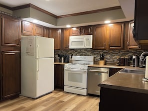 Coffee/tea maker, fridge, microwave, oven