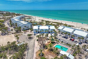 An aerial view of a resort with multiple buildings, a beach, and a swimming pool. - Beach Villa 2126: Rare 2-Story Gulf-Front Gem – Panoramic Views & Brand New Loft (Captiva)