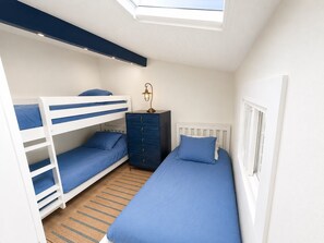 A compact bedroom with bunk beds, a dresser, and a single bed. - Beach Villa 2126: Rare 2-Story Gulf-Front Gem – Panoramic Views & Brand New Loft (Captiva)