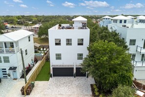 A modern multi-story building with a flat roof, a covered patio area, and a small pool. - 3 houses/3 pools/2 rooftops/panoramic ocean & downtown views (St. Augustine)
