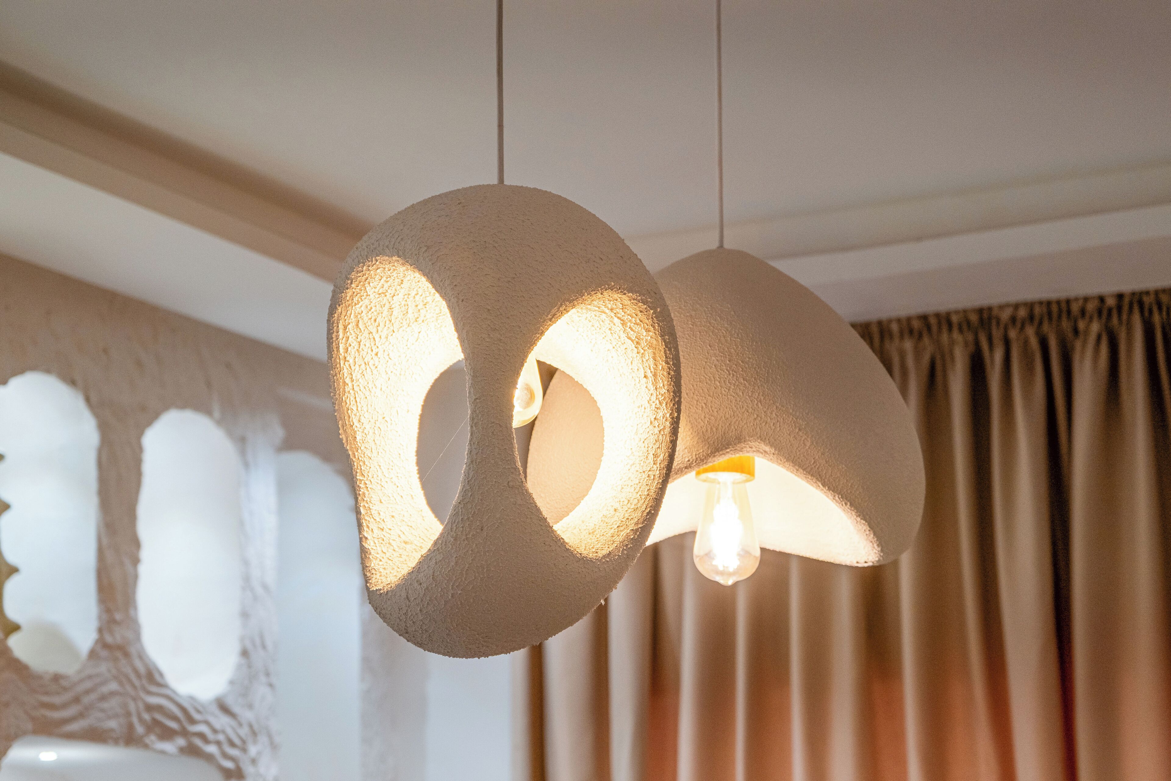 A modern interior with a unique circular light fixture.