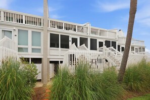 A multi-story building with a white exterior, multiple windows, and a balcony. - Modern Oceanfront Beach Club Villa *Unit 4* in Wild Dunes w/Community Pool! Screen Porch!! (Isle Of Palms)