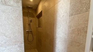 A small, enclosed shower area with tiled walls and a showerhead. - Romantic apartment sea view, 2 guests (Le Lavandou)