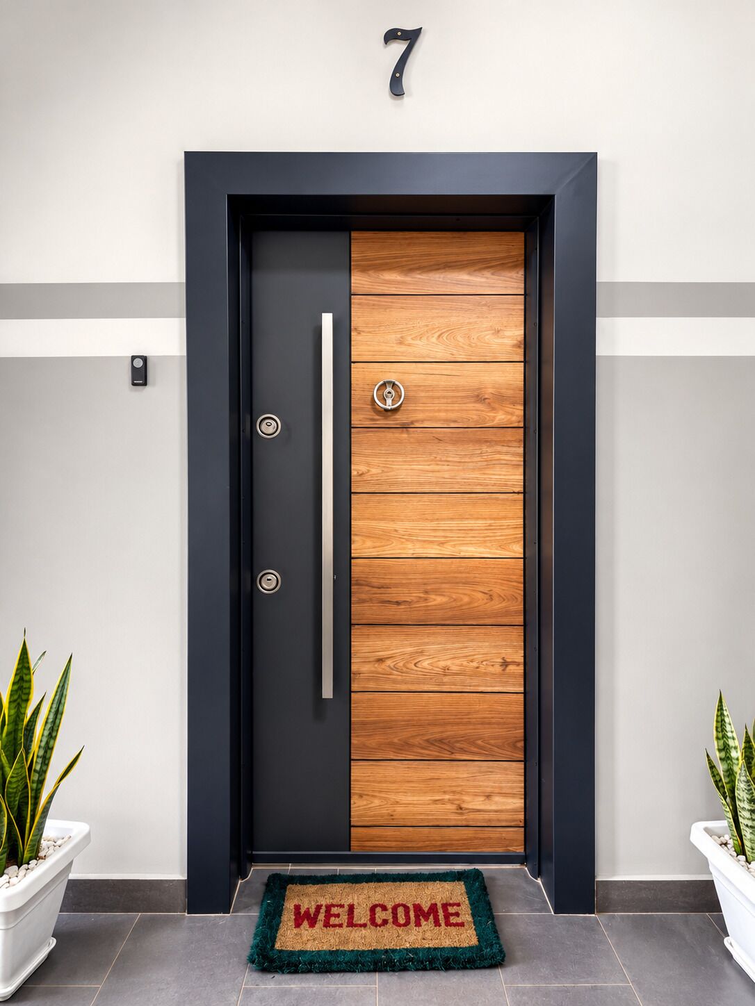 A modern door with a number 7 above it, a wooden panel design, and a welcome mat at the entrance.