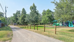 A gravel path leading to a playground with a slide and climbing structures. - Walk to Park & Creek! Spearfish Couples Retreat (Spearfish)