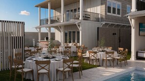 An outdoor dining area with multiple round tables set for a meal, surrounded by chairs. - The Estate | BRAND-NEW 2 Luxury Homes • Connected Backyards • Walk to Beach (Santa Rosa Beach)