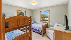 A bedroom with two bunk beds, a single bed, a desk with a computer, and a TV. - New Listing, Private Pool, Hot Tub, Walk to Beach, Dogs Welcome C0919 (Corolla)