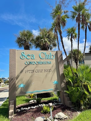 A sign for Sea Club Condominiums at 19725 Gulf Blvd. - Steps from the white sand! Spacious 2-bedroom, 2-bath Pet Friendly 20 LBS (Indian Shores)