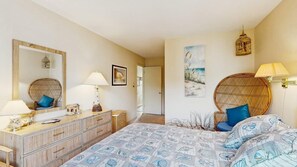 A bedroom with a bed, dresser, and two lamps. - East of the Sun 39866 E Sun Dr 327 (Fenwick Isle)