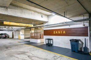 A parking garage with a sign reading 'Elevators to Bahia 4002-4523'. - Luxury Baytowne Wharf- Bahia Breeze -Pool View (Miramar Beach)