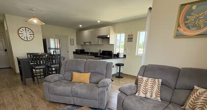 Buccoo Bliss Getaway, Modern Condo with Pool, Tropical Vibes & Close to Beaches