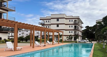 Buccoo Bliss Getaway, Modern Condo with Pool, Tropical Vibes & Close to Beaches