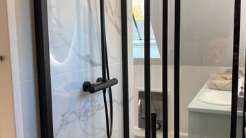 Shower, hair dryer, towels, soap