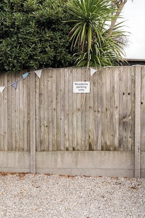A wooden fence with a sign indicating 'Residents parking only.' - The Cabin At The Beach (Seasalter)