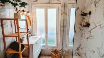 Shower, hair dryer, towels, soap