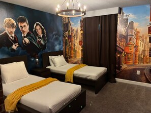 A hotel room with two beds, a large wall mural, and a chandelier. - Themed Rooms 4 BD/ 3 BA/ Storey Lake - 3083 PP (Kissimmee)