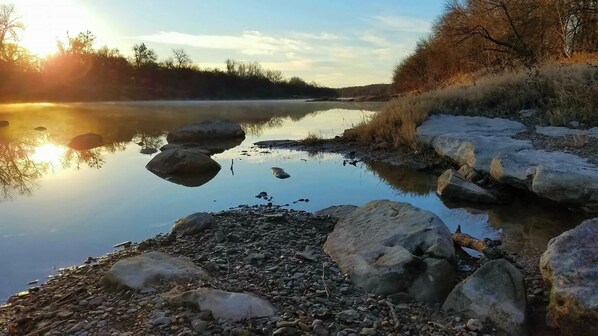 A calm river with rocks and a clear sky. - Brazos Bliss Retreat - River Escape (Weatherford)