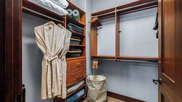 Walk-in closet with robes, yoga mats and extra blankets