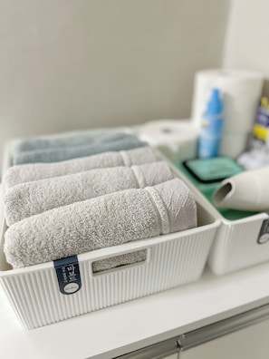 A white storage unit with towels and toiletries. - Annie Stay Chungmuro Near Myeongdong & Namsan Your Cozy Home in Central Seoul (중구)