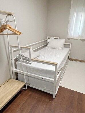 A single-bed room with a wooden ladder, a white mattress, and a white pillow. - Annie Stay Chungmuro Near Myeongdong & Namsan Your Cozy Home in Central Seoul (중구)