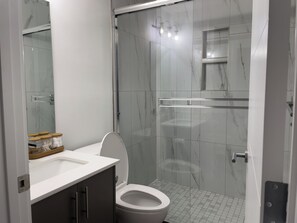 Shower, hair dryer, towels, soap - One Bedroom  Basement Suite in Southwest Calgary (Calgary)