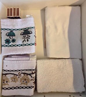 A set of towels with different patterns and textures.
