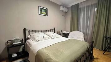 Family Quadruple Room, Balcony, City View | Desk, free WiFi