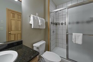 A bathroom with a toilet, sink, and shower. - Delightful studio in Breckenridge winter wonderland -mountain/ski getaway (Breckenridge)