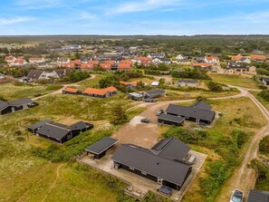 An aerial view of a residential area with houses, roads, and green spaces. - "Arsi" - 350m from the sea by Interhome (Thisted)