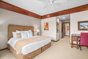 A hotel room with a bed, a desk, and a chair. - Poipu Kapili Condo 4 by Alekona Kauai - 2BR Oceanfront (Koloa)