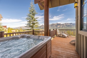 A hot tub on a wooden deck with a mountain view. - NEW! Ski In/Out + Private Hot Tub in Moonlight (Big Sky)