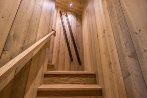 A wooden staircase with a handrail and wooden steps. - NEW Listing | Ski In/Out + Private Hot Tub in Moonlight (Big Sky)