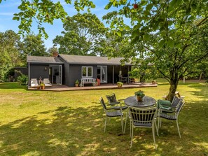 A house with a patio, outdoor seating, and a lawn. - "Elenora" - 200m from the sea by Interhome (Odder)