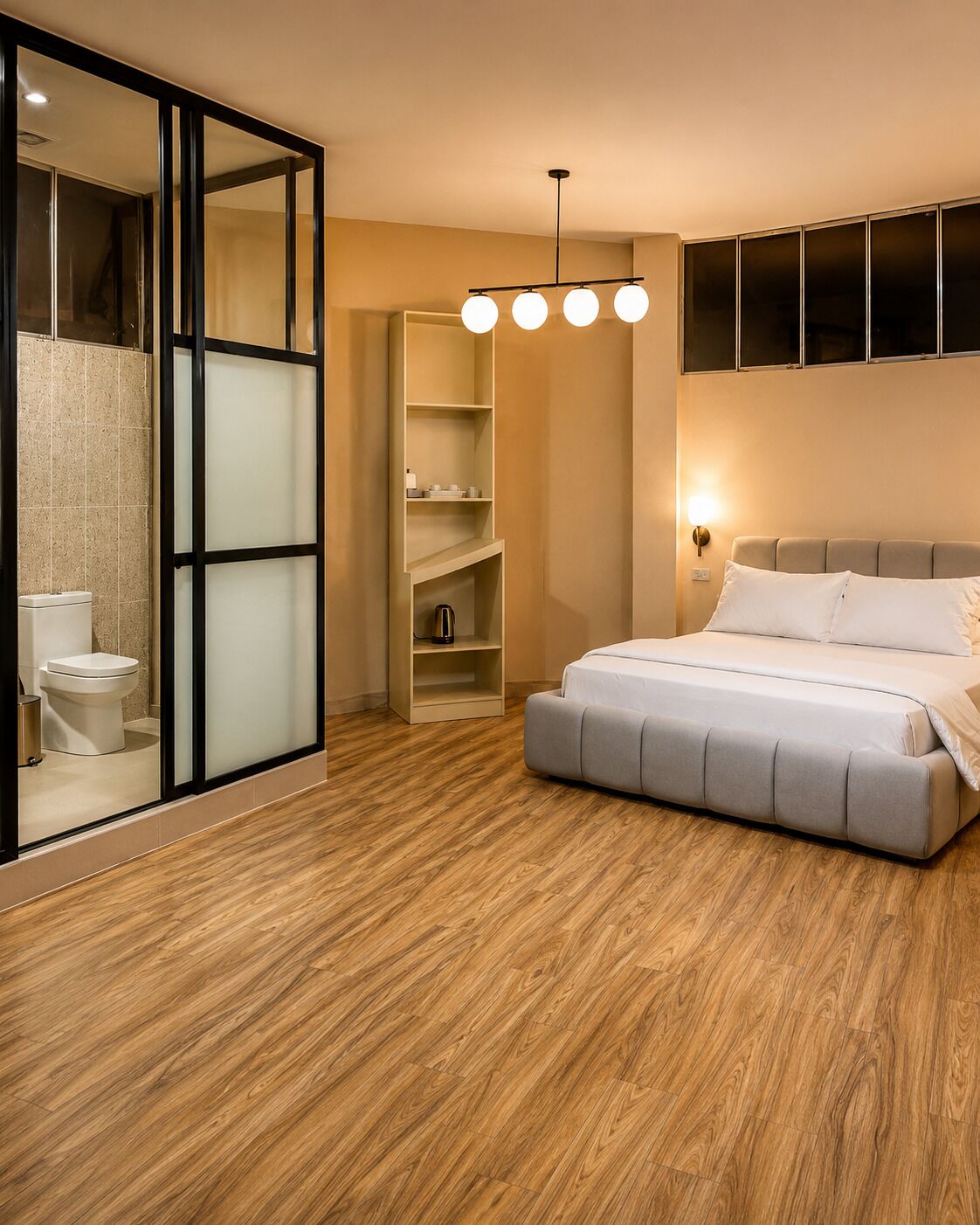 A bedroom with a bed, a wardrobe, a built-in shelf unit, and a toilet.