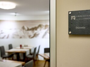 A sign with the text 'GRISCHUNNA MOUNTAIN LODGE Stüvetta' mounted on a wall. - Apartments Grischuna Mountain Lodge, (Samnaun-Dorf) by Interhome (Samnaun)