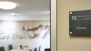 A sign indicating 'GRISCHUNNA MOUNTAIN LODGE Stüvetta' on a wall. - Apartments Grischuna Mountain Lodge, (Samnaun-Dorf) by Interhome (Samnaun)
