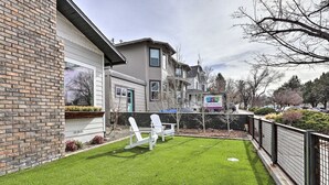 A residential property with a well-maintained lawn, a patio with outdoor seating, and a fenced yard. - Family Home, Hot Tub, Near Whiskey Row (Prescott)